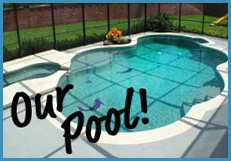 A landscaped outdoor pool with clear blue water. There is a small attached hot tub on the left side. The pool area is surrounded by a fence, and the words "Our Pool!" are written in black cursive on the lower left corner of the image.