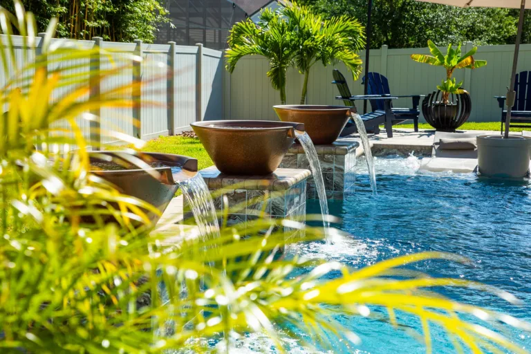 Pool with bowl water features and tropical landscaping