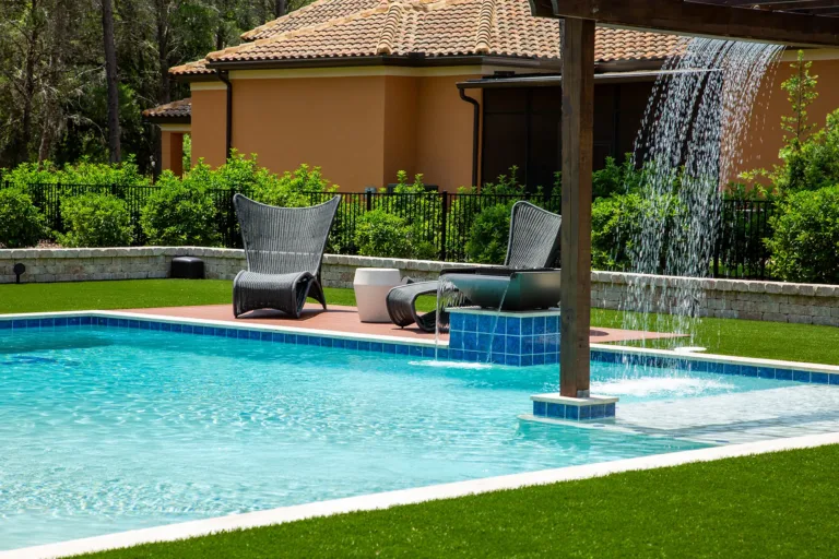 Pool with raised spa, spillway and sheer descent