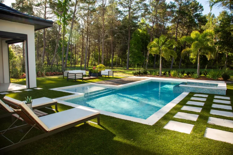 Geometric pool with stepping-stone pavers set in turf